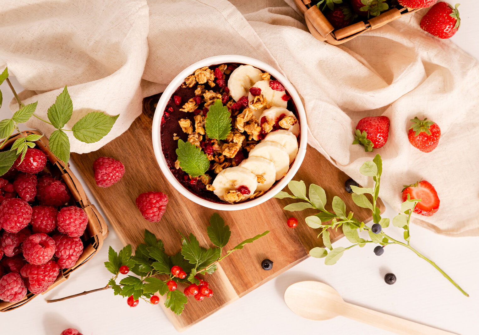 Food photography of a decorative smoothie bowl for a Finnish coffee chain focused on serving dishes with traditional Finnish berries found in forests.
